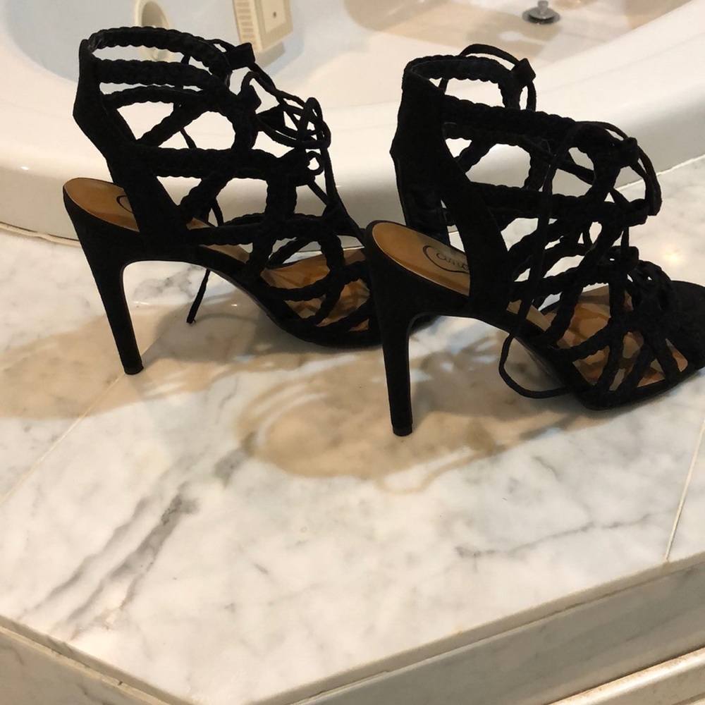 Net style, lace up heels in black. Never worn.